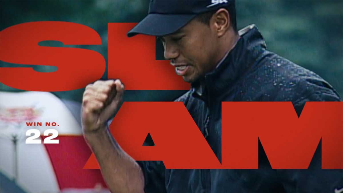 Tiger Woods pumping his first with text that reads Slam win number 22