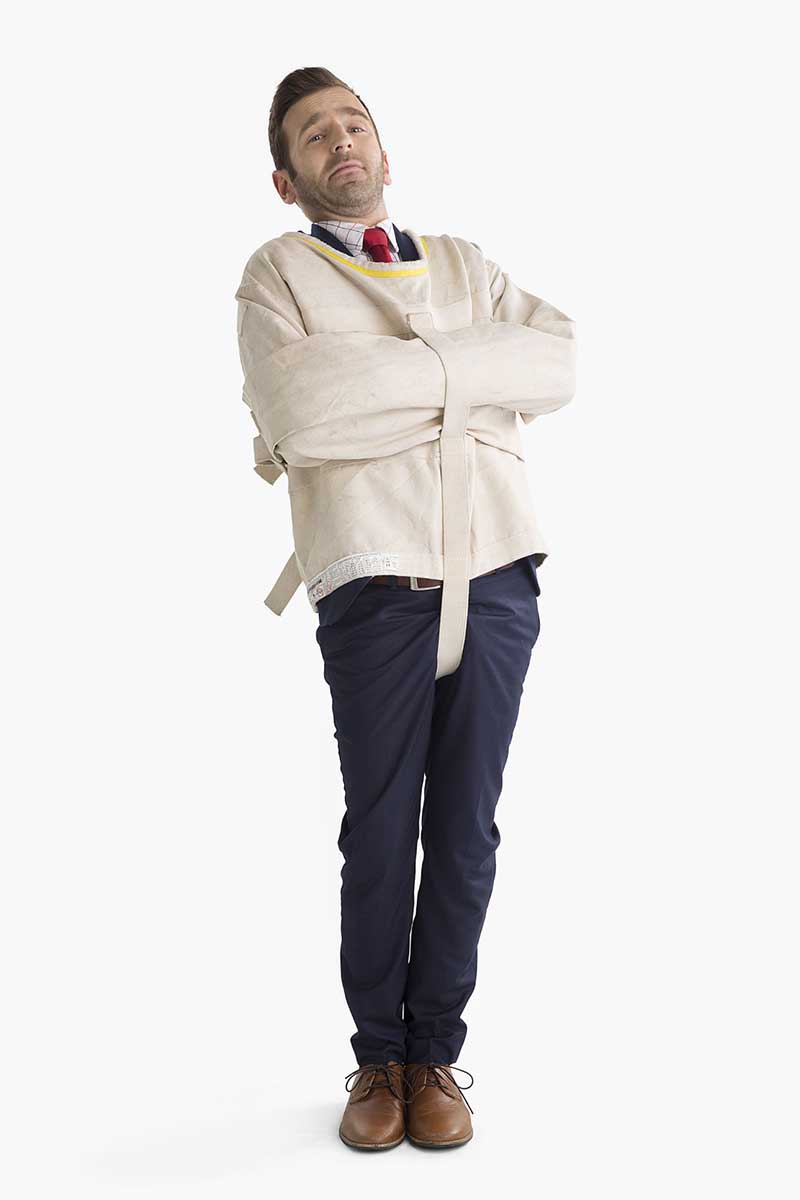 Mitsubishi Electric spokesperson wearing a straitjacket