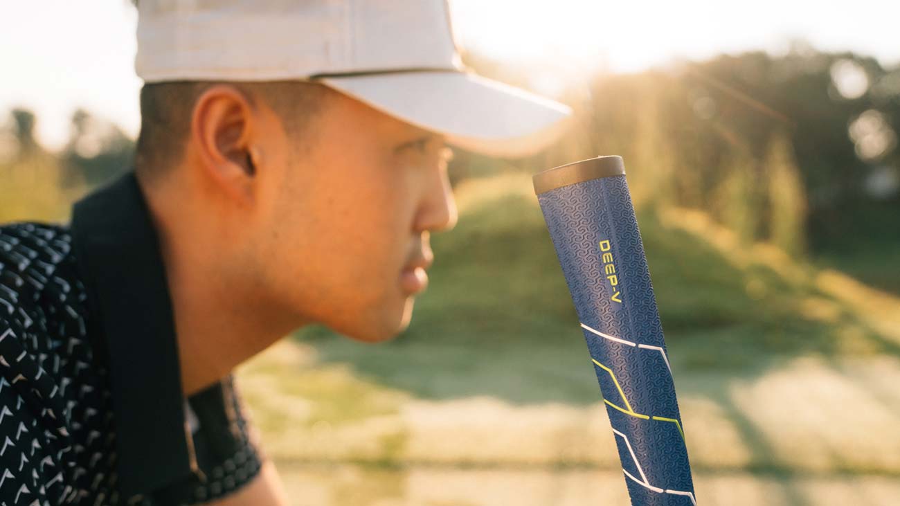 Golfer lining up put with SINKFIT Deep-V putter